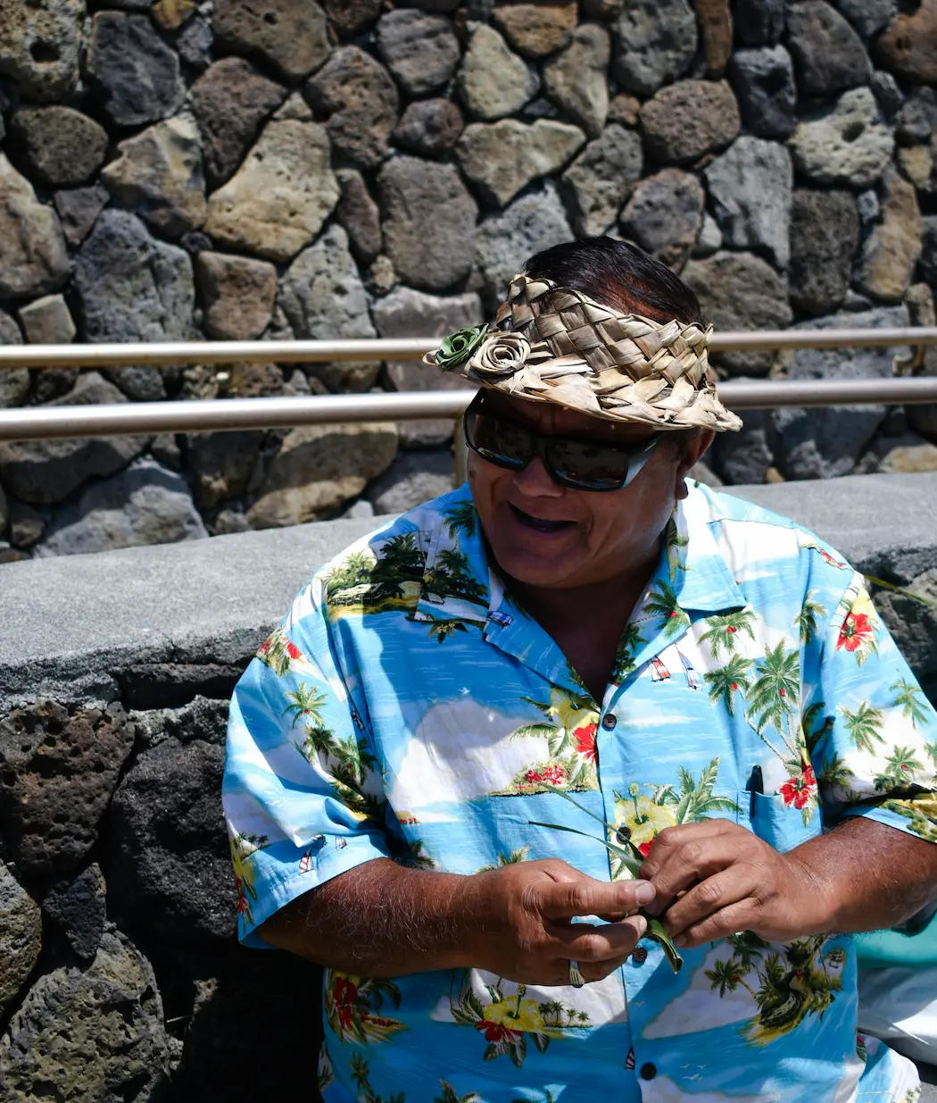Local Hawaiian Guide Weaving at a tour stop
