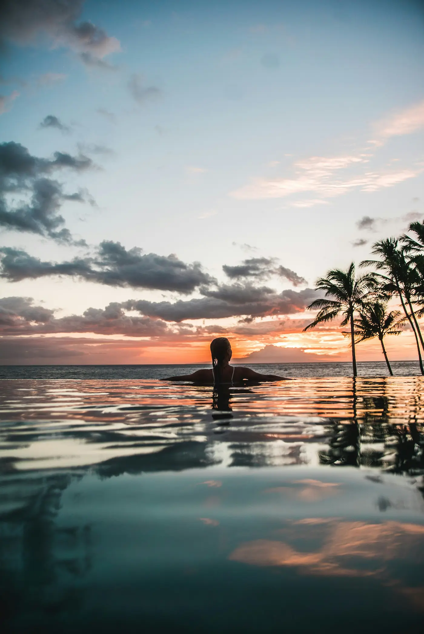 Women swimming at Sunset in Hawaii.